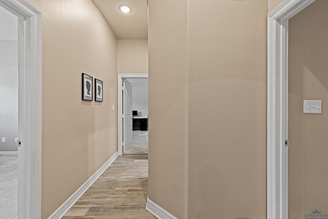 hallway featuring light hardwood / wood-style floors