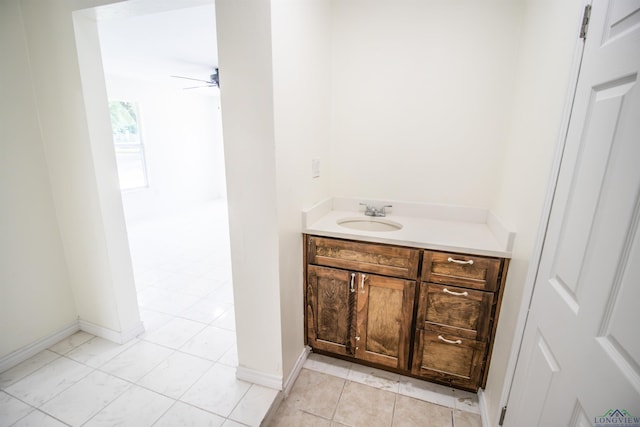 180 Martha St, Waskom, TX 75692 - bathroom with vanity, ceiling fan, and baseboards
