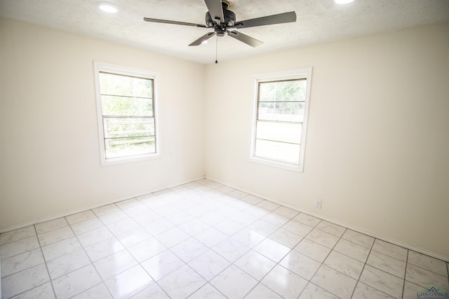 180 Martha St, Waskom, TX 75692 - spare room featuring ceiling fan, recessed lighting, and a textured ceiling