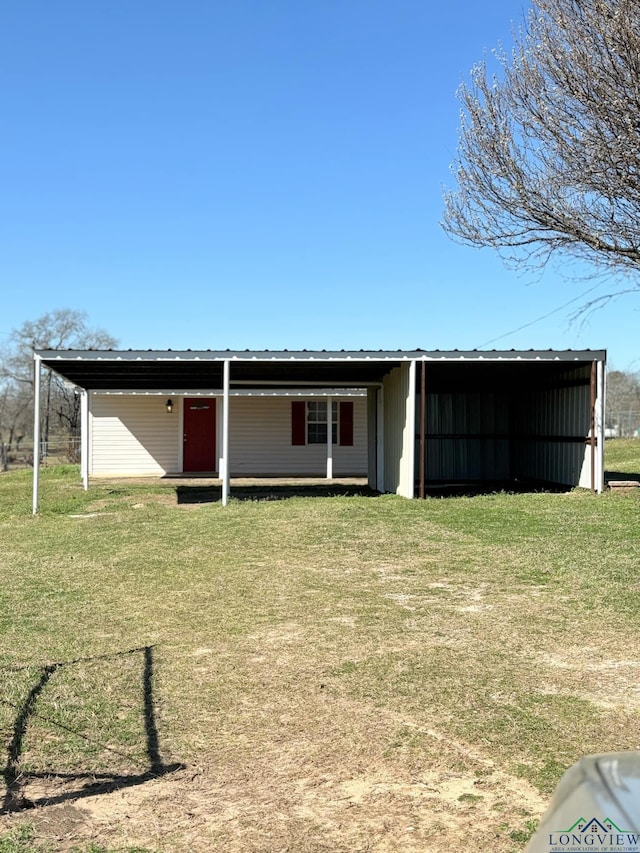 view of pole building with a yard