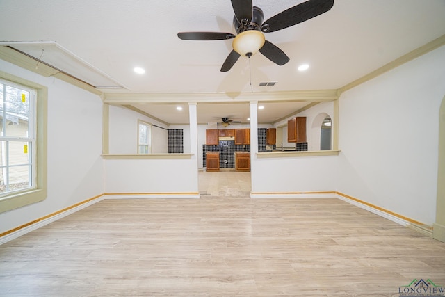 unfurnished living room with ornamental molding, ceiling fan, and light hardwood / wood-style flooring