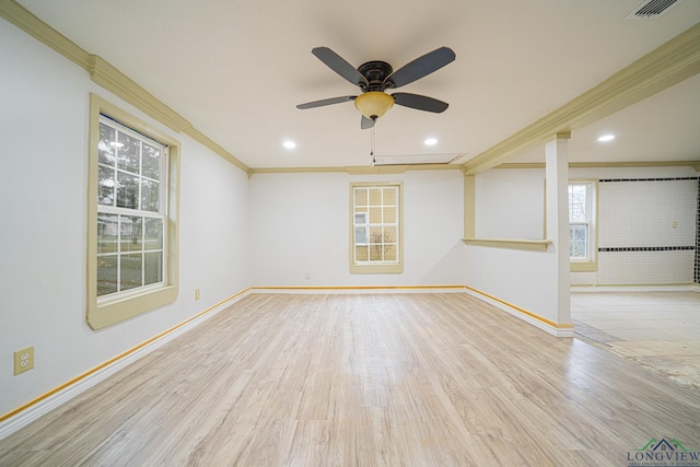 spare room with crown molding, ceiling fan, and light wood-type flooring