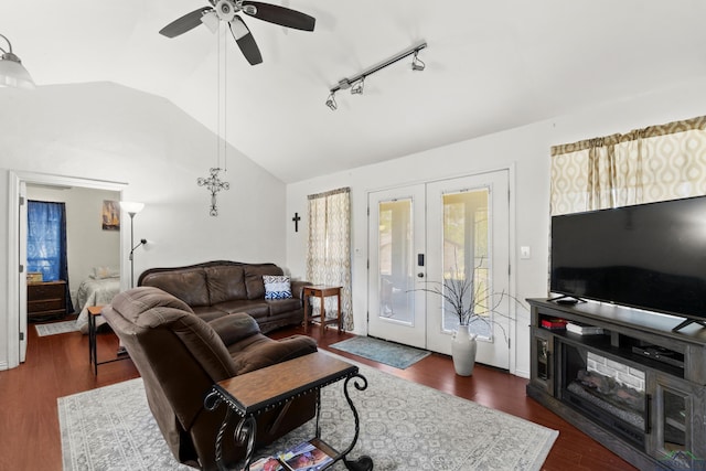 7869 Arrowwood Rd, Gilmer, TX 75644 - living area featuring lofted ceiling, french doors, healthy amount of natural light, a ceiling fan, and dark wood-style flooring