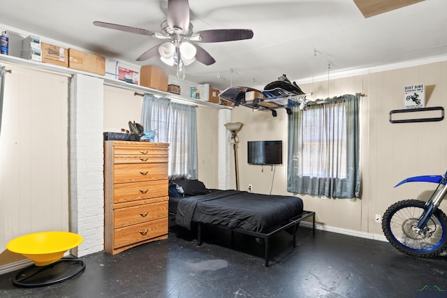 7869 Arrowwood Rd, Gilmer, TX 75644 - bedroom featuring baseboards, a ceiling fan, and finished concrete floors