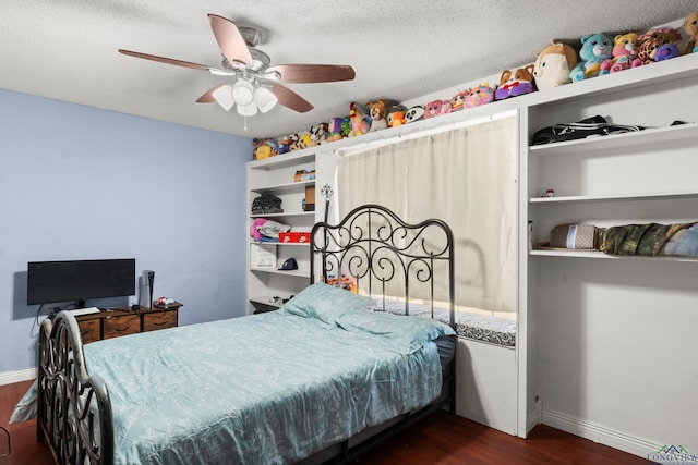 7869 Arrowwood Rd, Gilmer, TX 75644 - bedroom featuring wood finished floors, baseboards, and a ceiling fan