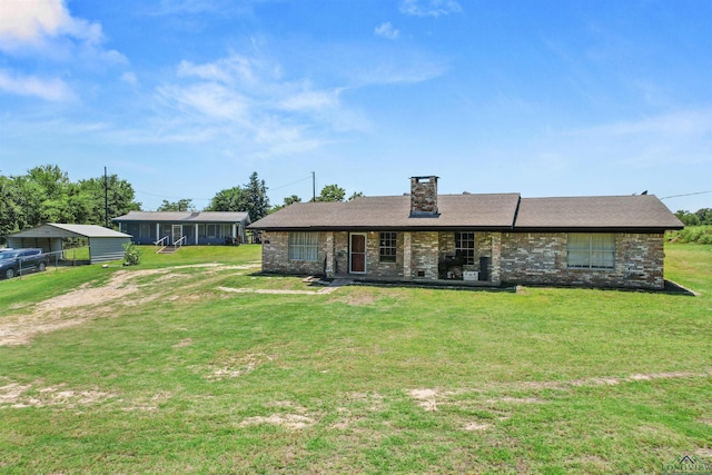 7869 Arrowwood Rd, Gilmer, TX 75644 - single story home with a front lawn, brick siding, and a chimney