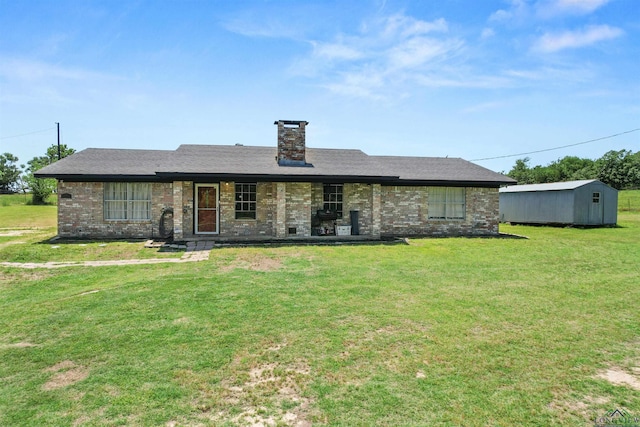 7869 Arrowwood Rd, Gilmer, TX 75644 - ranch-style home featuring a front yard, a chimney, brick siding, an outdoor structure, and a shed