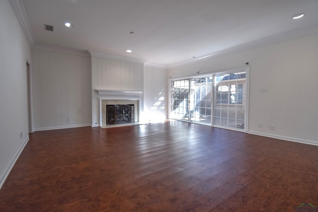 unfurnished living room with ornamental molding, dark hardwood / wood-style flooring, and a premium fireplace