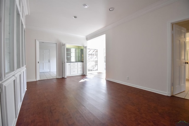 unfurnished living room featuring crown molding and tile patterned floors