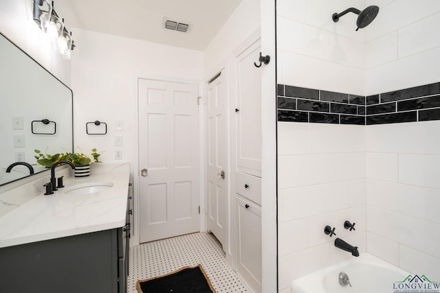1427 S Wall Ave, Tyler, TX 75701 - full bathroom featuring vanity, washtub / shower combination, and tile patterned floors