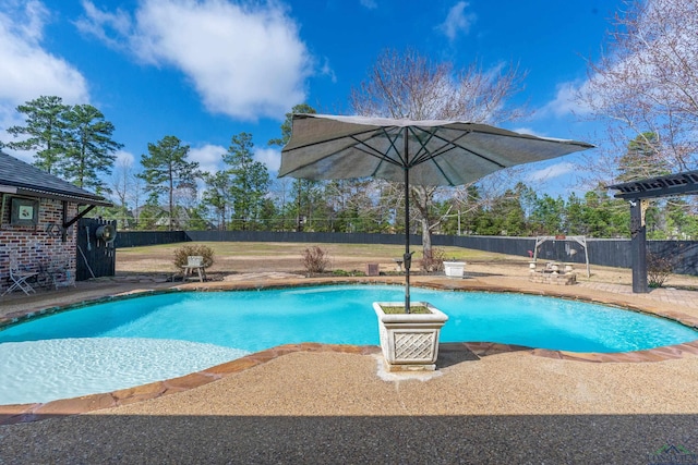 view of pool featuring a patio, a fenced backyard, and a fenced in pool