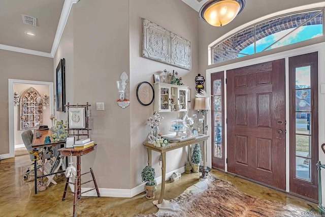 foyer entrance with recessed lighting, visible vents, crown molding, and baseboards