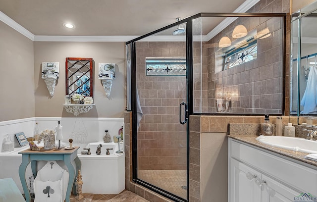 bathroom featuring a shower stall, ornamental molding, a bath, and vanity