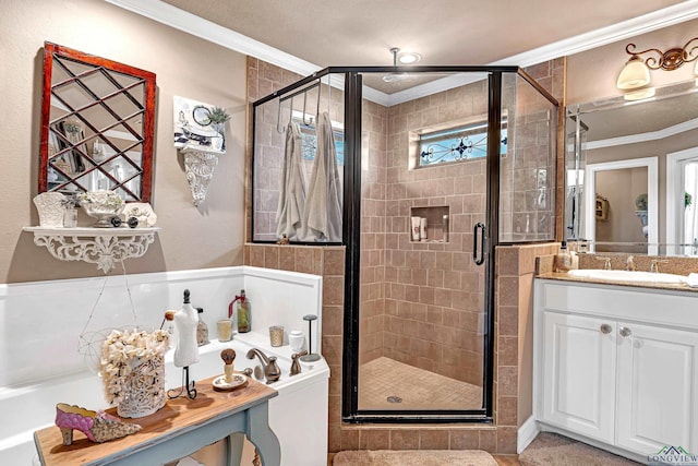 full bathroom with ornamental molding, a stall shower, and vanity