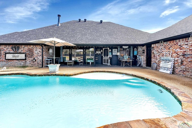 pool with a patio area