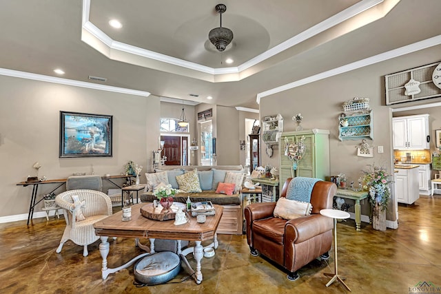 living area featuring baseboards, finished concrete floors, a tray ceiling, and recessed lighting