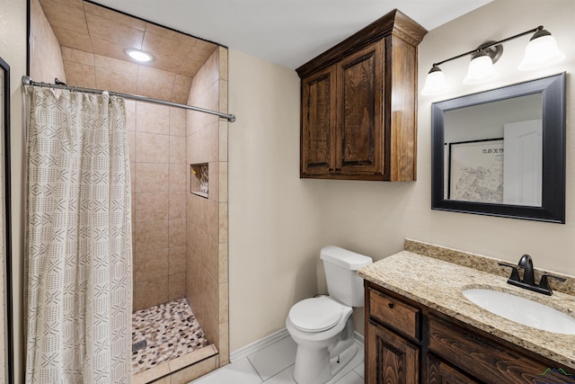 bathroom featuring toilet, vanity, tile patterned floors, and curtained shower