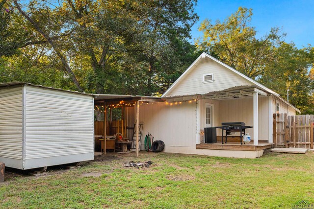 back of property featuring a lawn