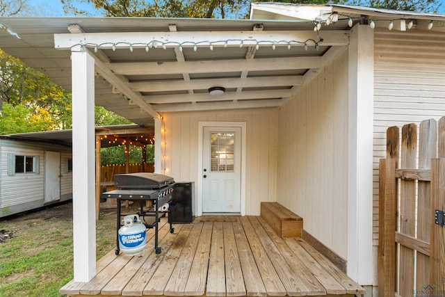 wooden deck with a grill