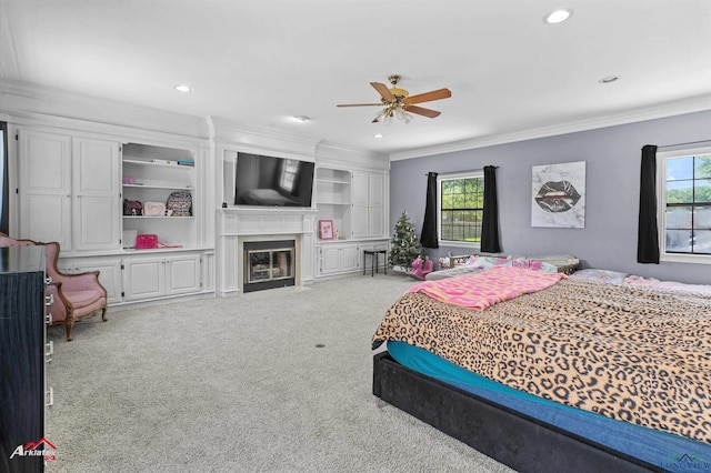 1208 Westwood Dr, Henderson, TX 75654 - carpeted bedroom with multiple windows, ornamental molding, recessed lighting, and a fireplace with flush hearth