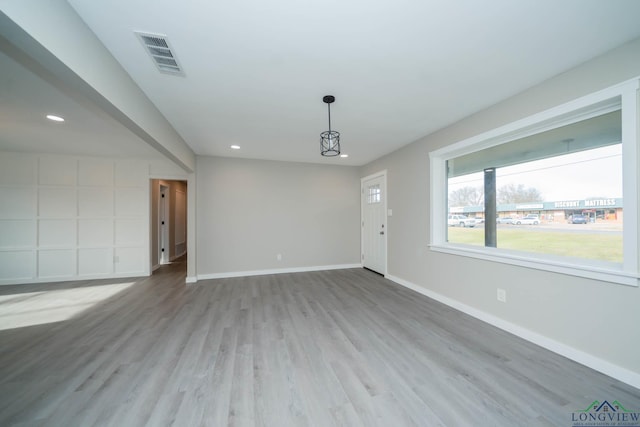 unfurnished room with light hardwood / wood-style flooring