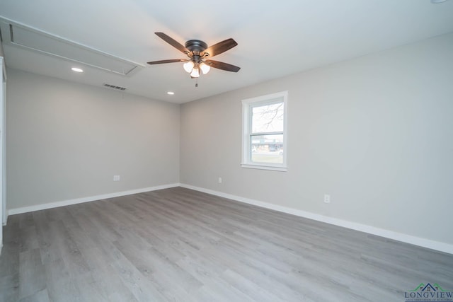 empty room featuring light hardwood / wood-style floors and ceiling fan