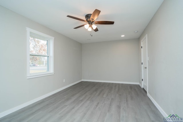 spare room with ceiling fan and light hardwood / wood-style flooring