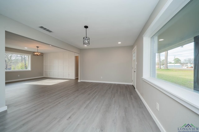 unfurnished living room with light hardwood / wood-style flooring