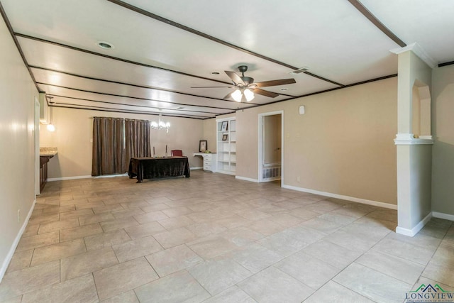 2820 W Upshur Ave, Gladewater, TX 75647 - living room featuring a ceiling fan, baseboards, a chandelier, and ornamental molding