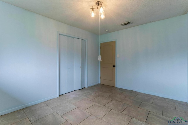 2820 W Upshur Ave, Gladewater, TX 75647 - unfurnished bedroom with baseboards and a closet