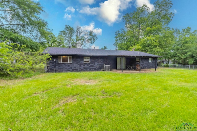 2820 W Upshur Ave, Gladewater, TX 75647 - rear view of property with central AC unit and a patio