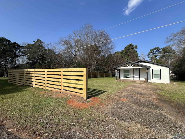 view of yard with covered porch