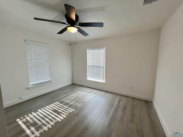 empty room featuring ceiling fan and wood-type flooring