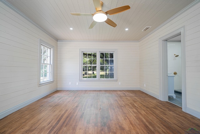 empty room with ceiling fan, crown molding, and dark hardwood / wood-style floors