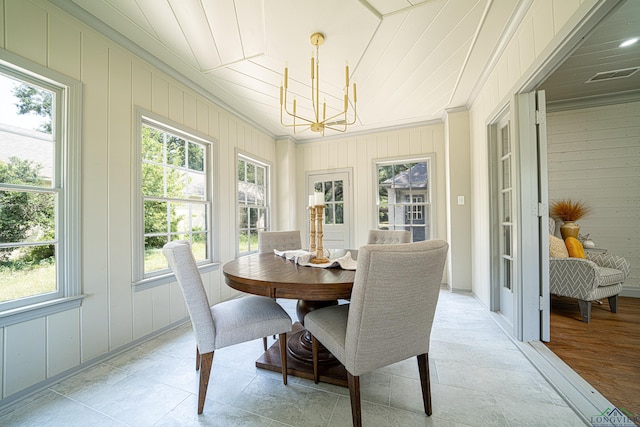 35 Covington Dr, Longview, TX 75602 - sunroom featuring a chandelier, ornamental molding, plenty of natural light, and wooden walls