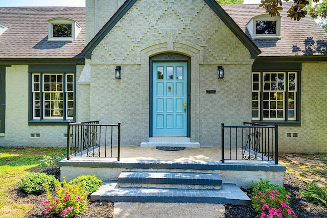 35 Covington Dr, Longview, TX 75602 - entrance to property featuring crawl space, roof with shingles, and stone siding