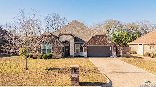 view of front facade with a garage and a front lawn