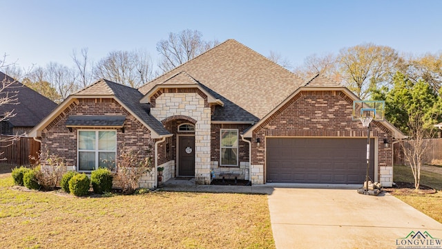 front of property featuring a garage and a front lawn