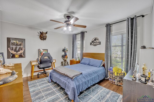 bedroom with wood finished floors and ceiling fan
