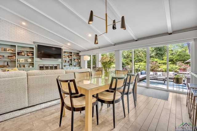 sunroom featuring plenty of natural light and beam ceiling
