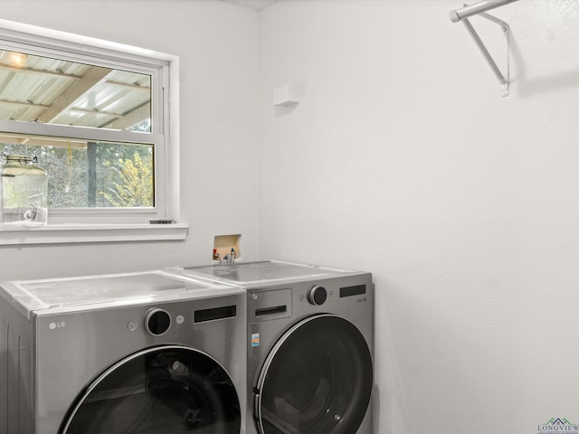 laundry room featuring washer and clothes dryer