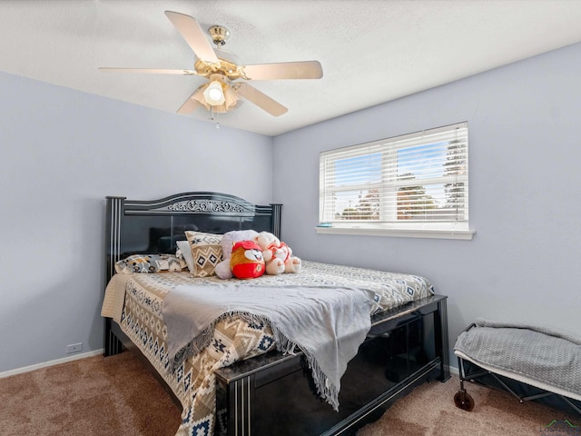 bedroom featuring ceiling fan and carpet floors