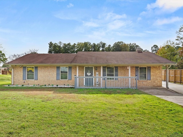 ranch-style house with covered porch and a front yard