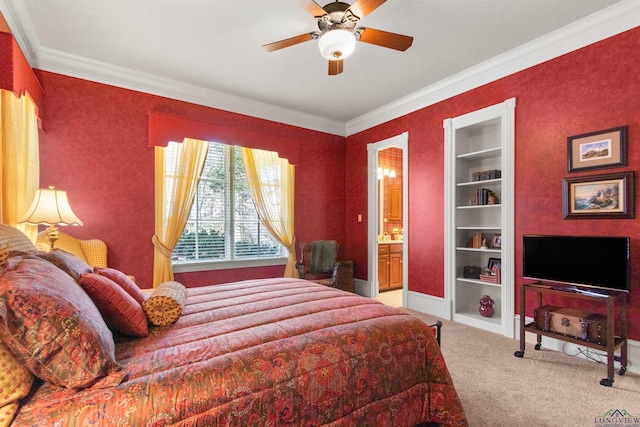 bedroom with crown molding, ceiling fan, connected bathroom, and carpet floors