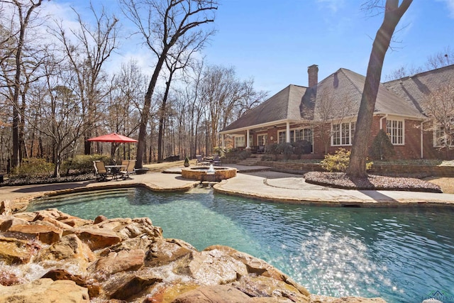 view of pool featuring a patio