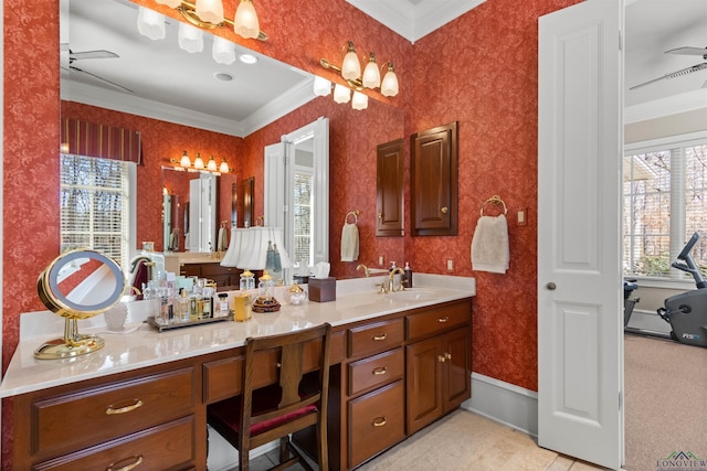 bathroom featuring vanity, ornamental molding, and ceiling fan