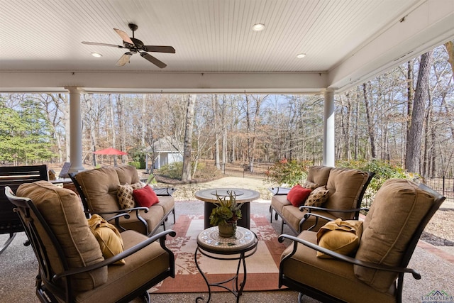 sunroom with wooden ceiling and ceiling fan