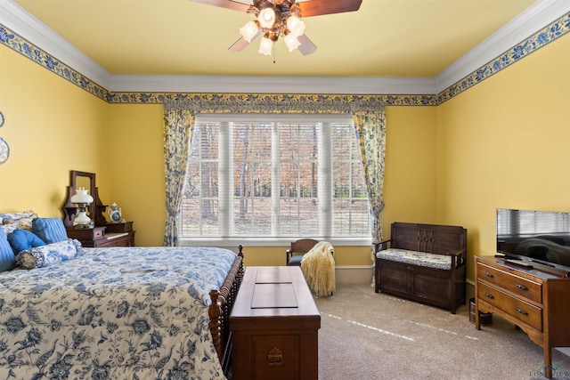 carpeted bedroom featuring crown molding and ceiling fan