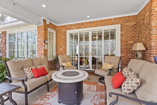 sunroom featuring wood ceiling and a healthy amount of sunlight