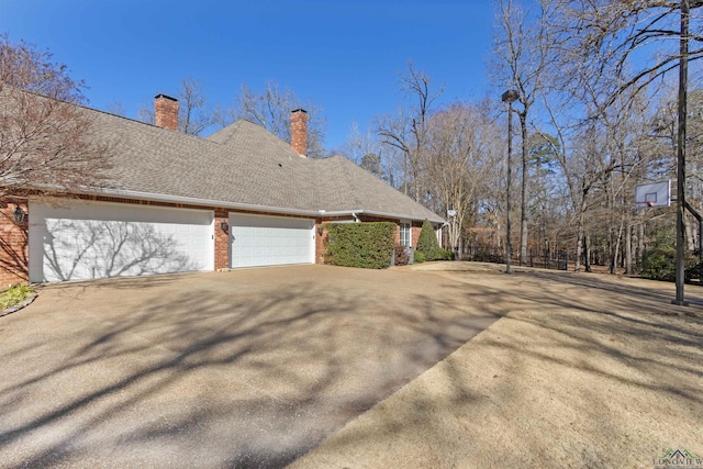 view of side of property with a garage